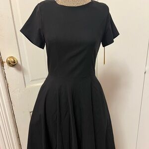 Black dress that ties in a bow in back at the top.